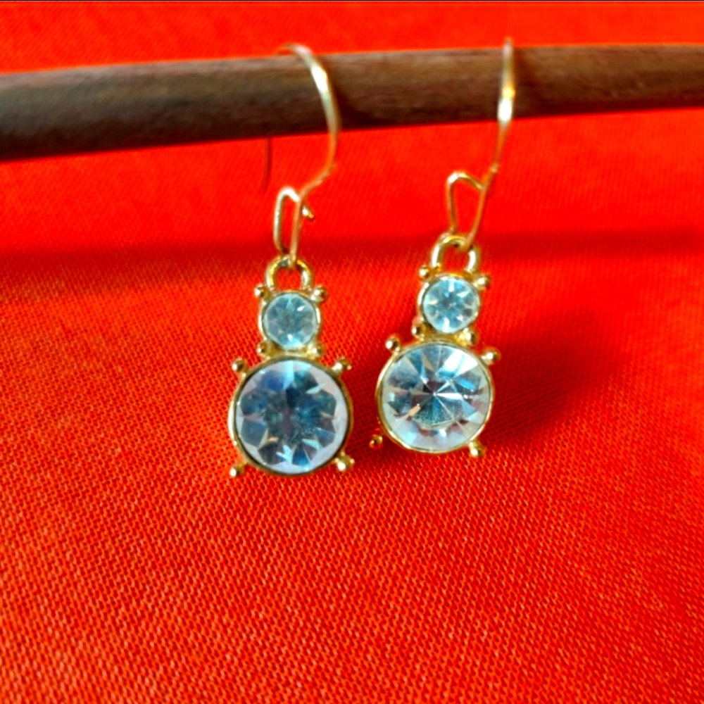 Rhinestone drop earrings set in gold tone setting